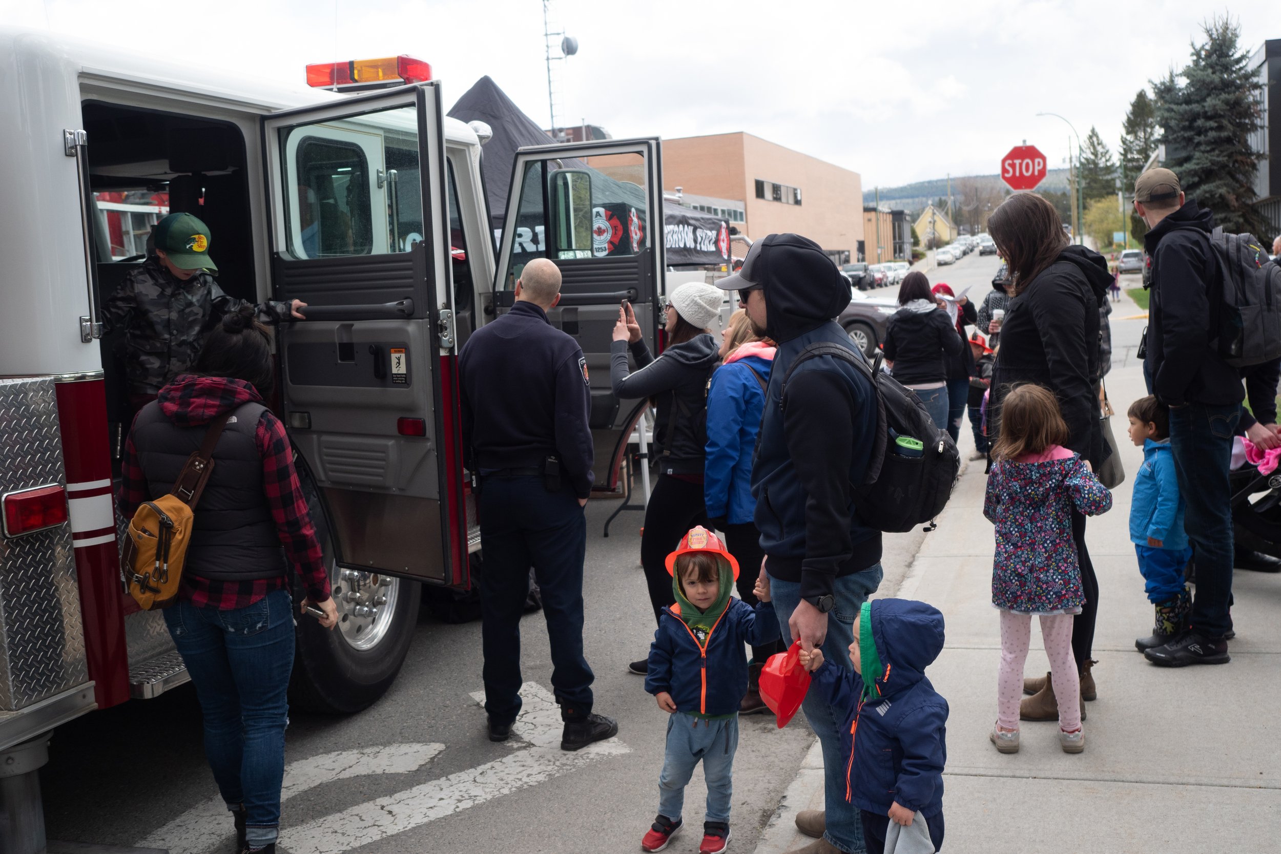Families at a community event outside Key City Theatre