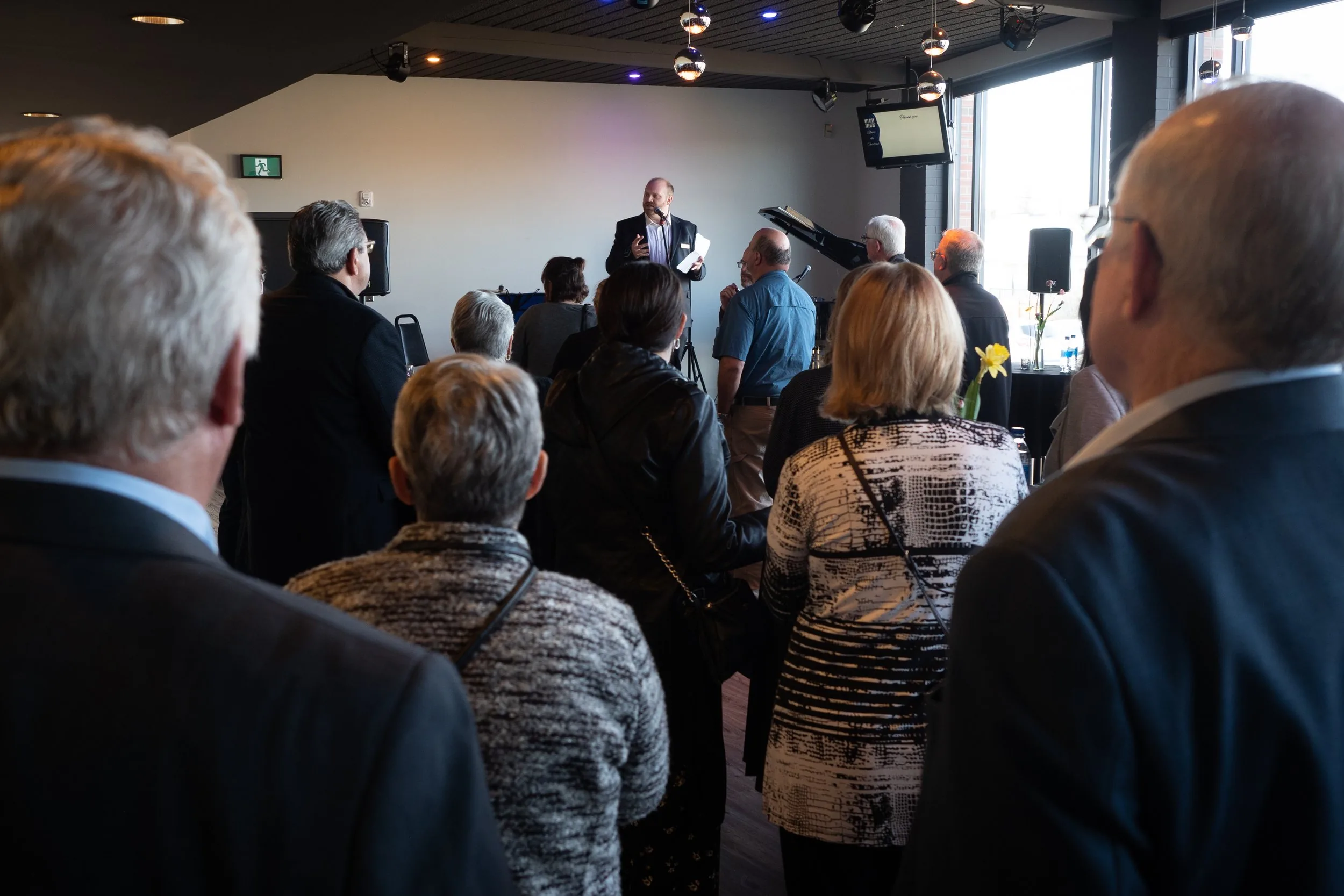 Guests at a reception in the Key City Theatre lobby