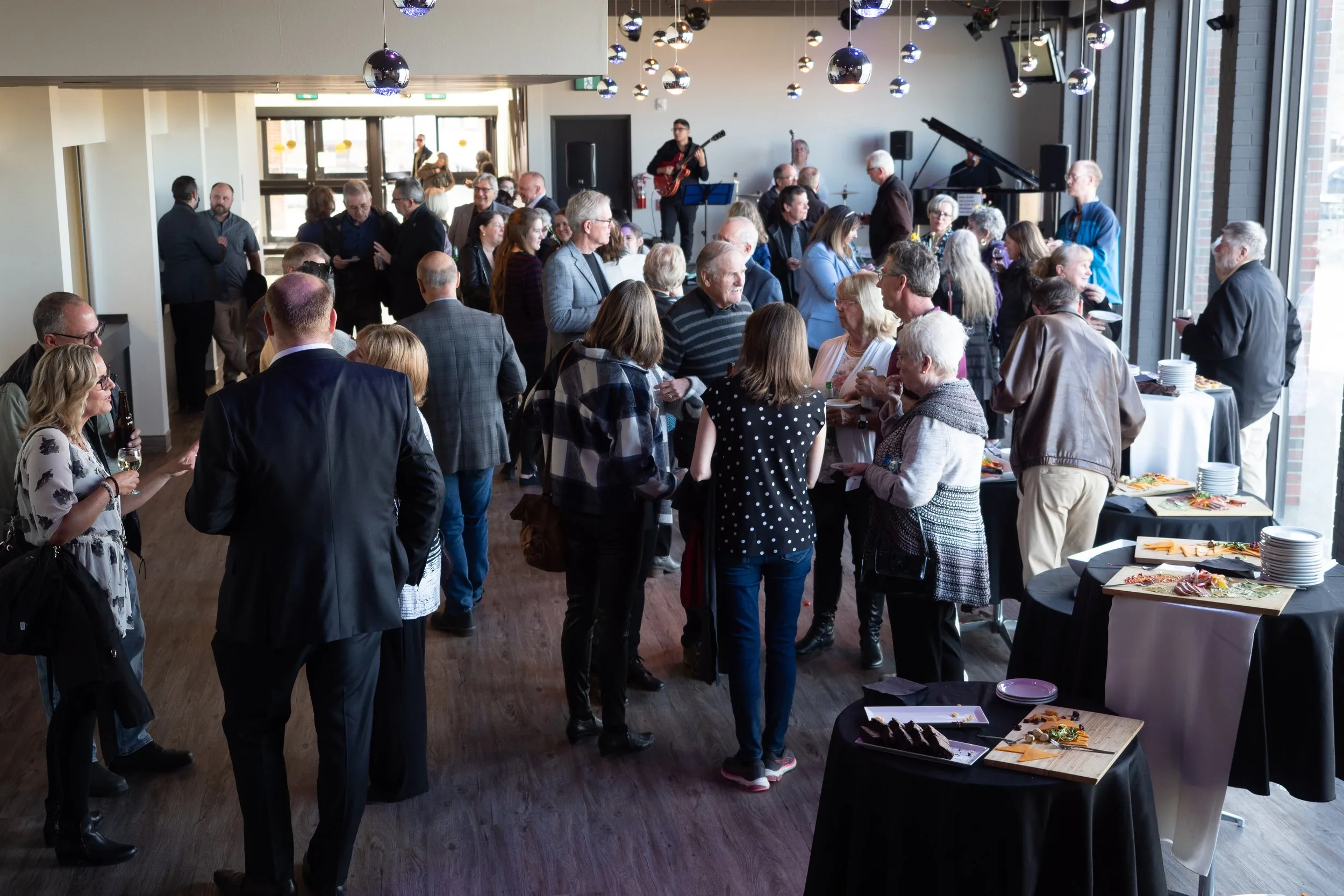 Wide view of the Key City Theatre lobby during a reception